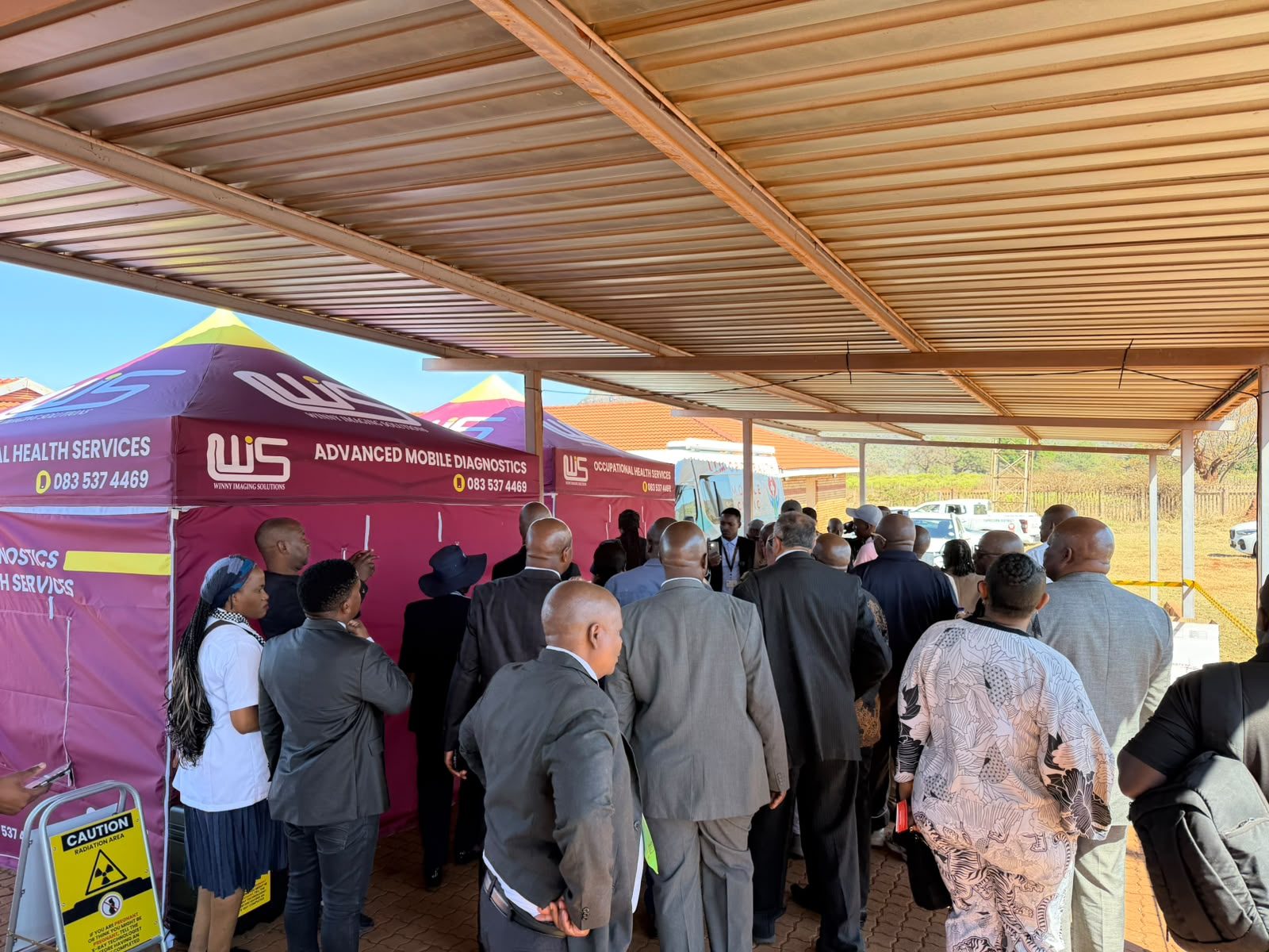 Community members and officials gathered at the mobile diagnostics tents during the Mafefe screening day
