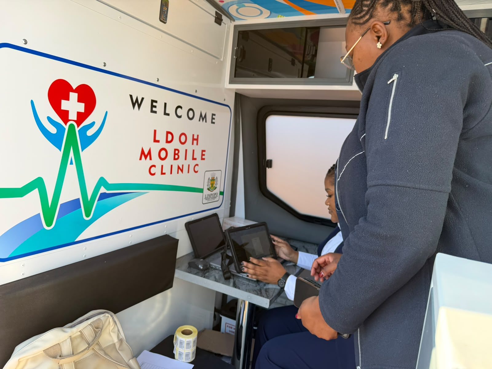 A health worker at the workstation inside the Limpopo Department of Health mobile clinic at Mafefe