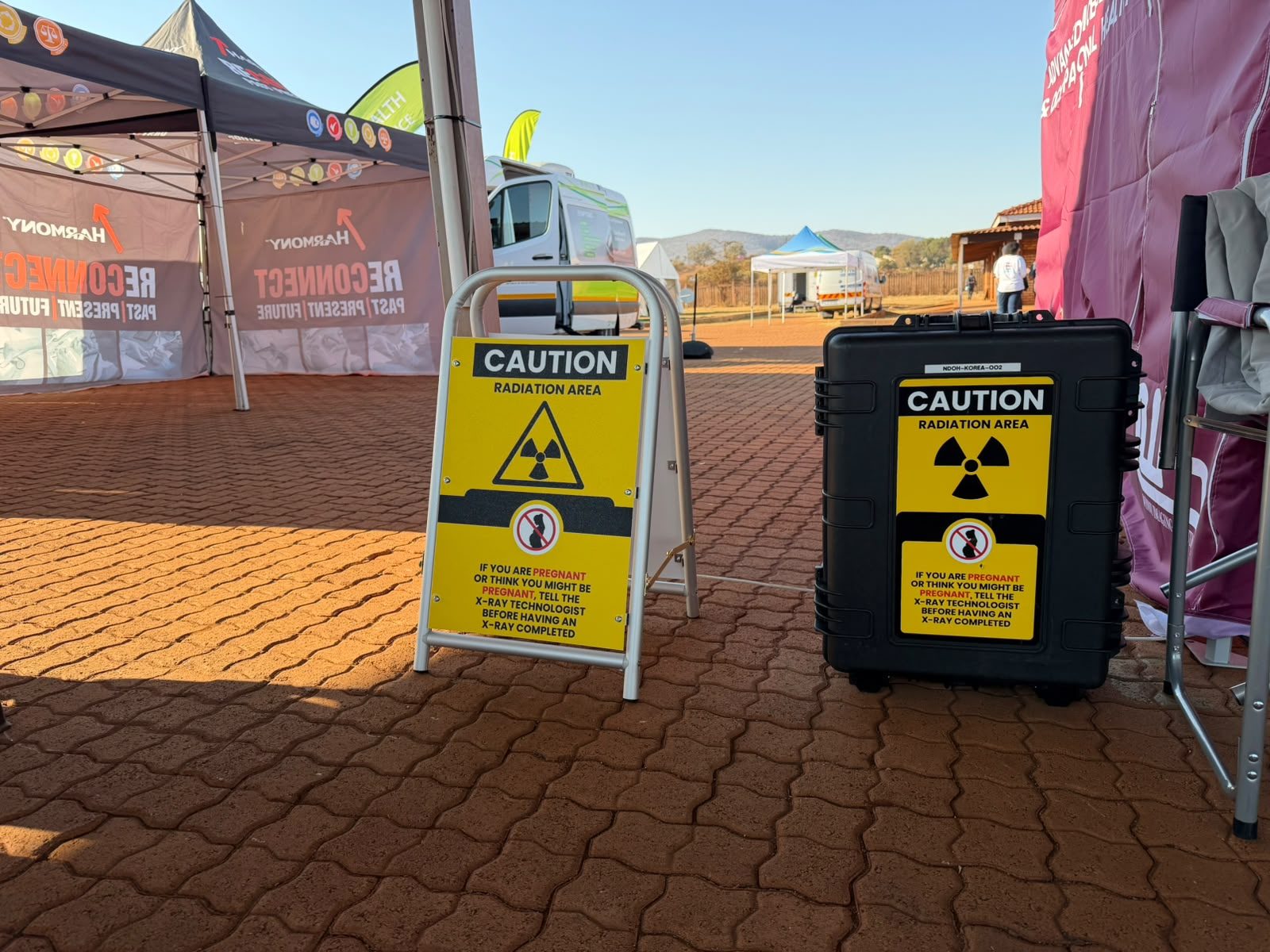 Radiation caution signage marking the controlled X-ray screening area at the Mafefe site
